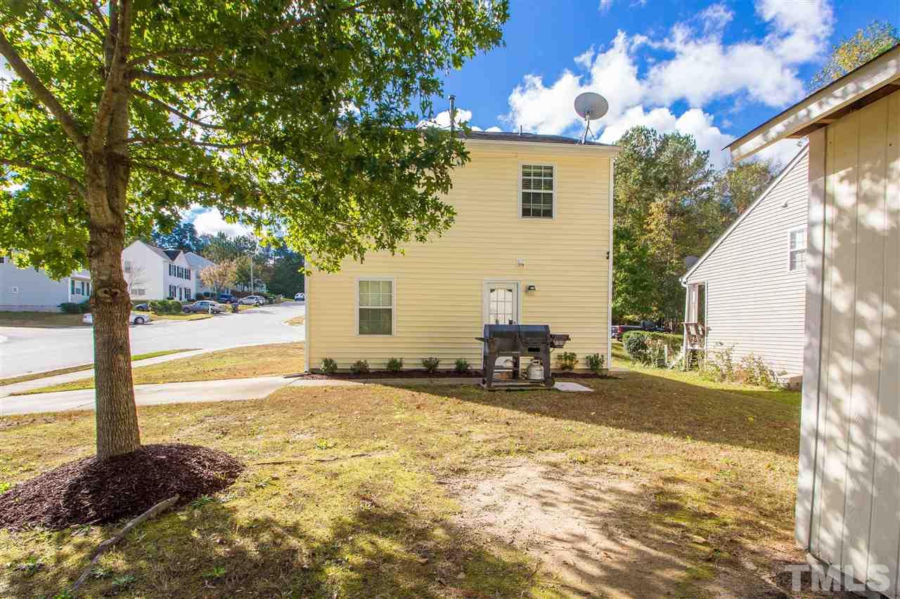 5729 Forest Point Road Raleigh, NC 27610 - Photo 23 of 26 a view of a house with backyard and sitting area