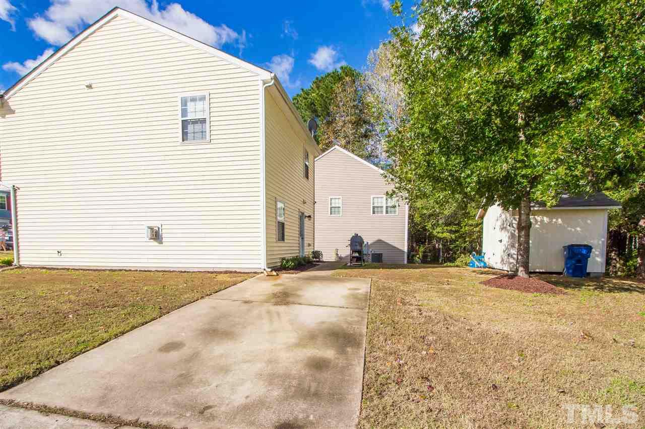 5729 Forest Point Road Raleigh, NC 27610 - Photo 24 of 26 a view of a house with a patio