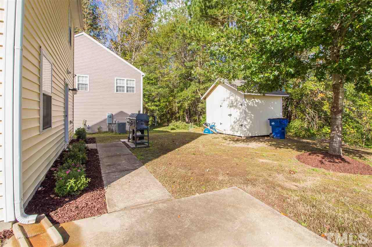 5729 Forest Point Road Raleigh, NC 27610 - Photo 26 of 26 a view of a back yard of the house