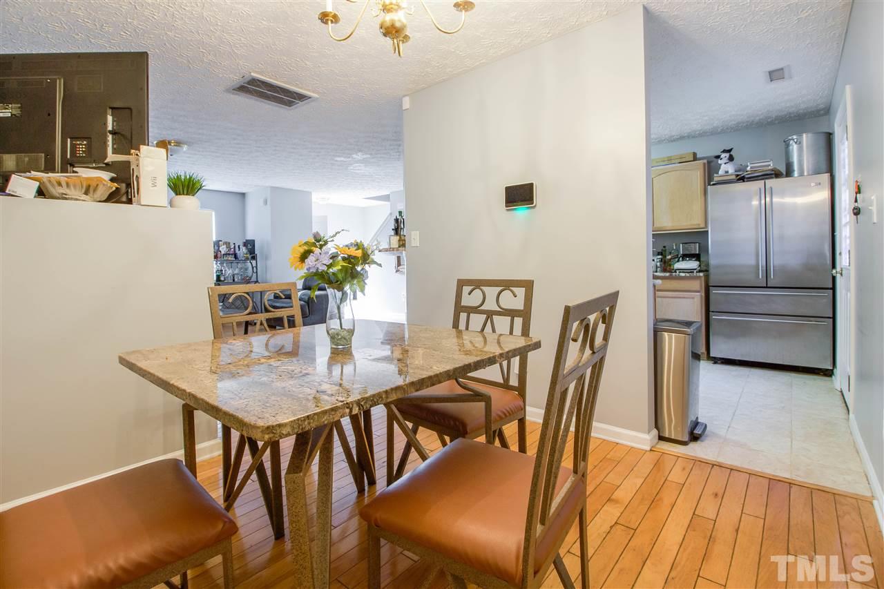 5729 Forest Point Road Raleigh, NC 27610 - Photo 6 of 26 a dining room with furniture and wooden floor