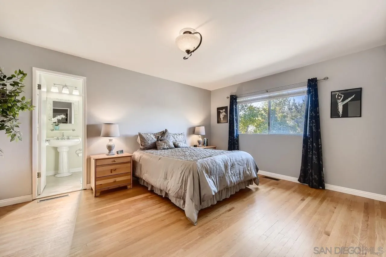 10158 Madrid Way Spring Valley, CA 91977 - Photo 12 of 27 a bedroom with bed and window