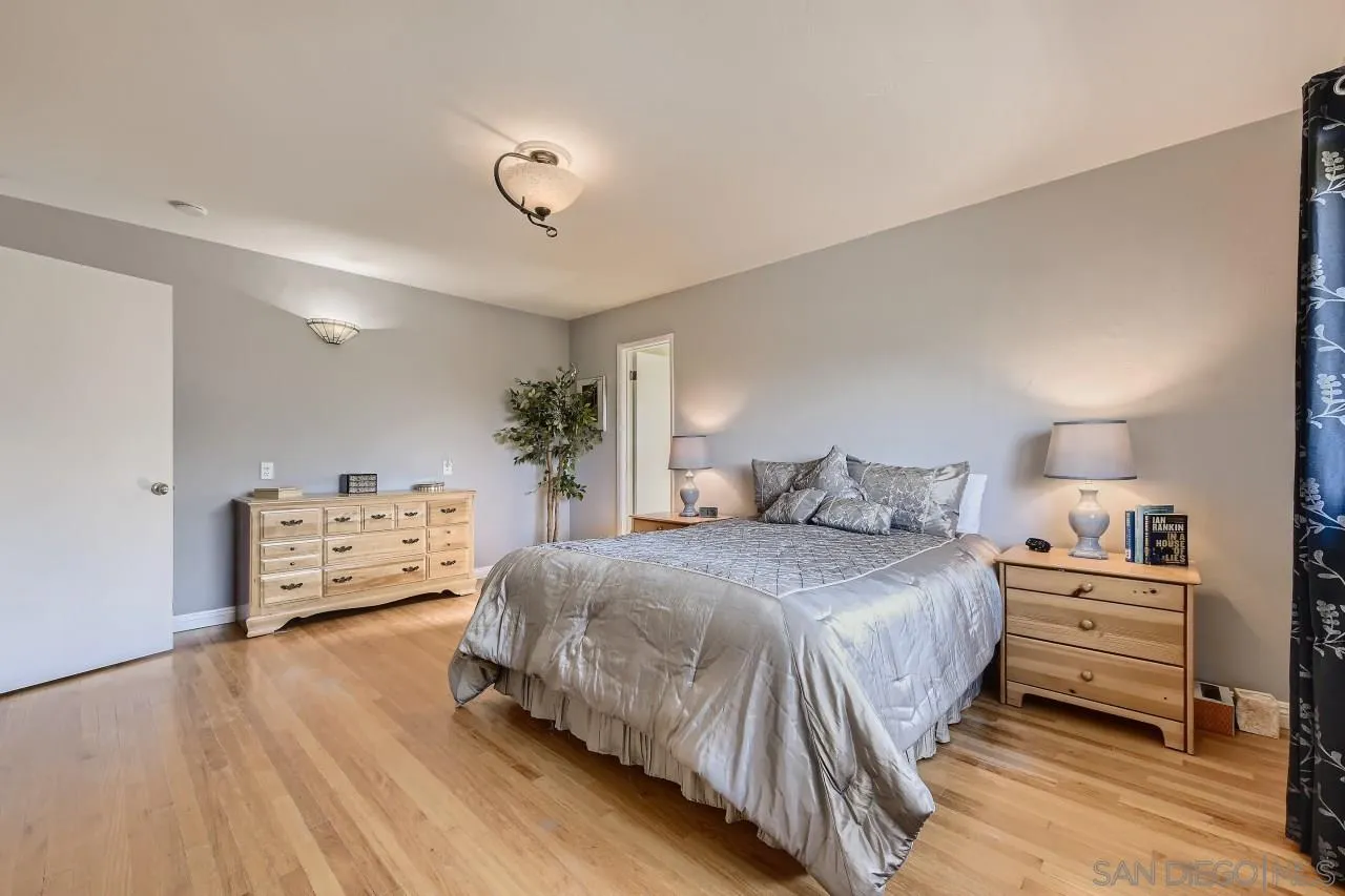 10158 Madrid Way Spring Valley, CA 91977 - Photo 13 of 27 a bedroom with a bed and a dresser