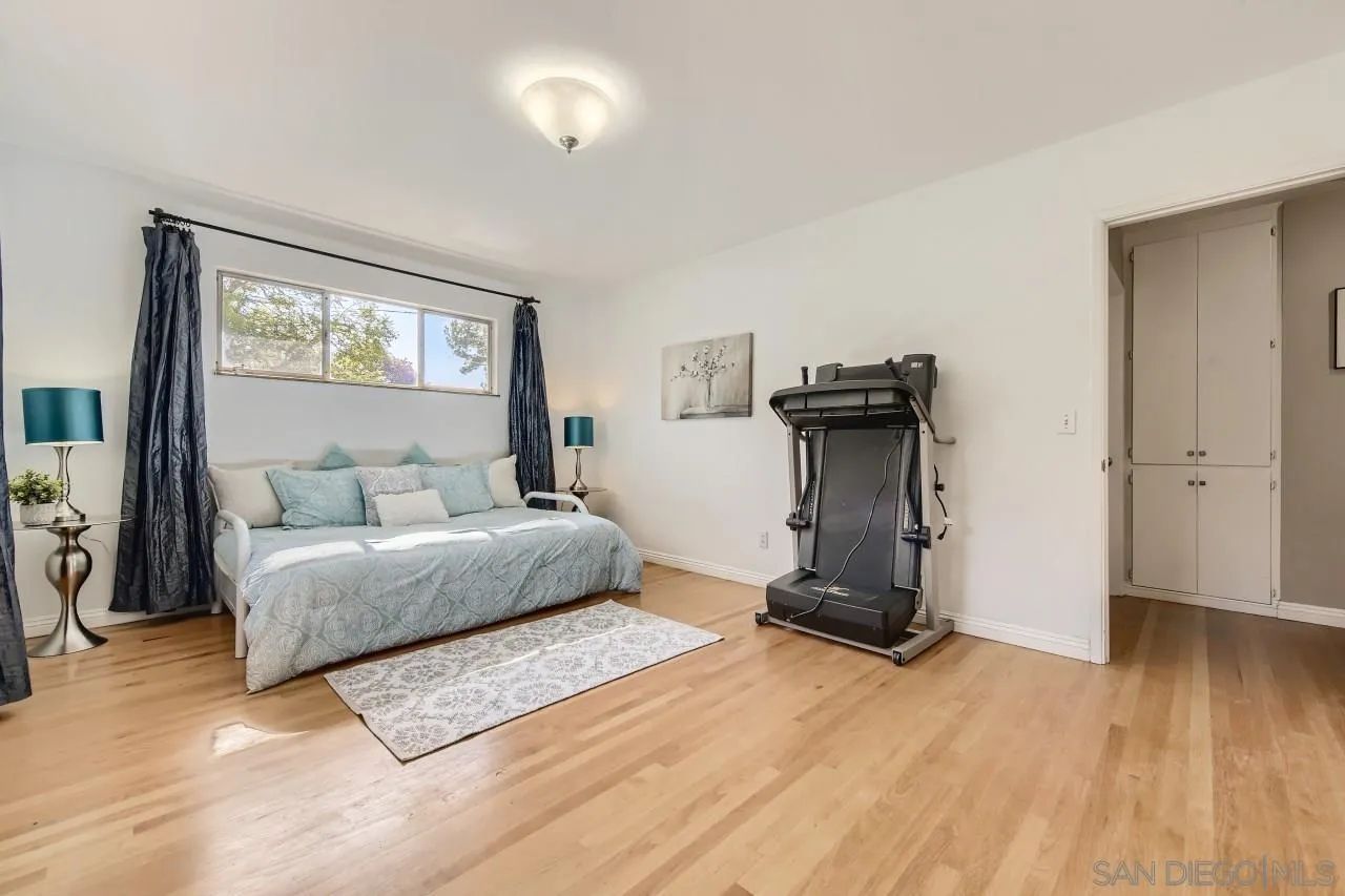 10158 Madrid Way Spring Valley, CA 91977 - Photo 17 of 27 a living room with furniture a wooden floor and a window