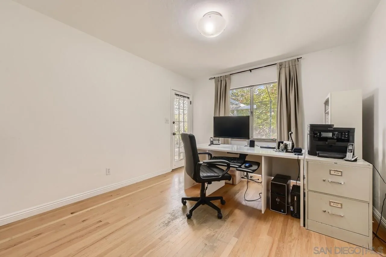 10158 Madrid Way Spring Valley, CA 91977 - Photo 20 of 27 a view of a workspace with furniture and a window