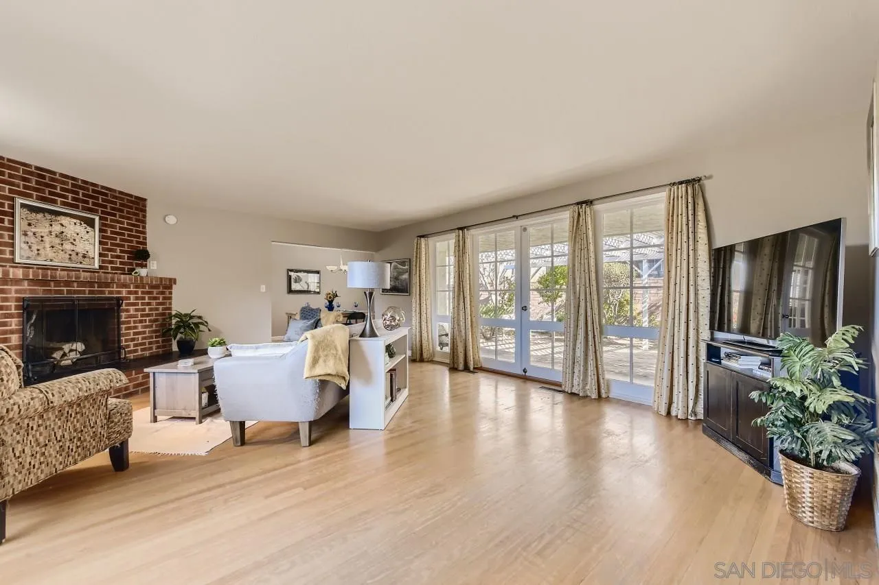 10158 Madrid Way Spring Valley, CA 91977 - Photo 7 of 27 a living room with furniture and a fireplace