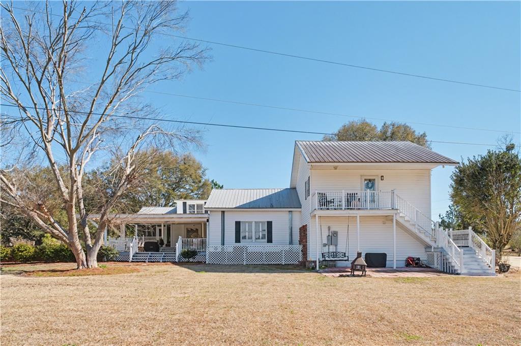 1833 Tom Odum Road Vidalia, GA 30474 - Photo 41 of 59 a view of a house with a snow in front of it