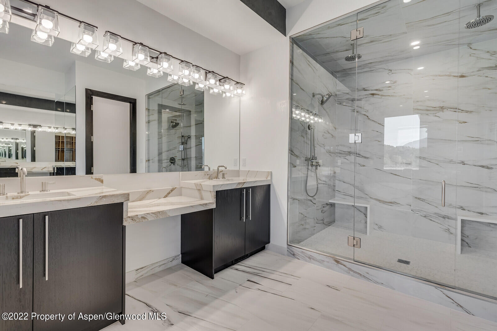 1093 Callicotte Ranch Road Carbondale, CO 81623 - Photo 17 of 27 a bathroom with a sink mirror and shower