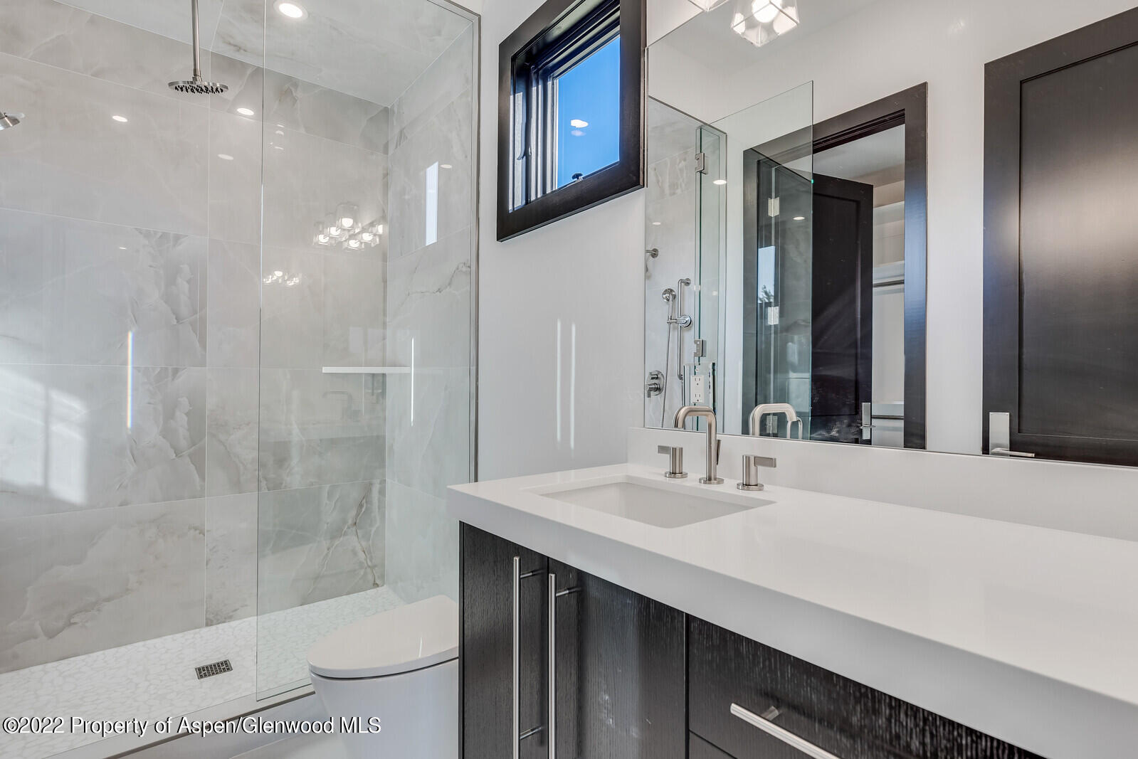 1093 Callicotte Ranch Road Carbondale, CO 81623 - Photo 21 of 27 a bathroom with a sink a toilet and shower