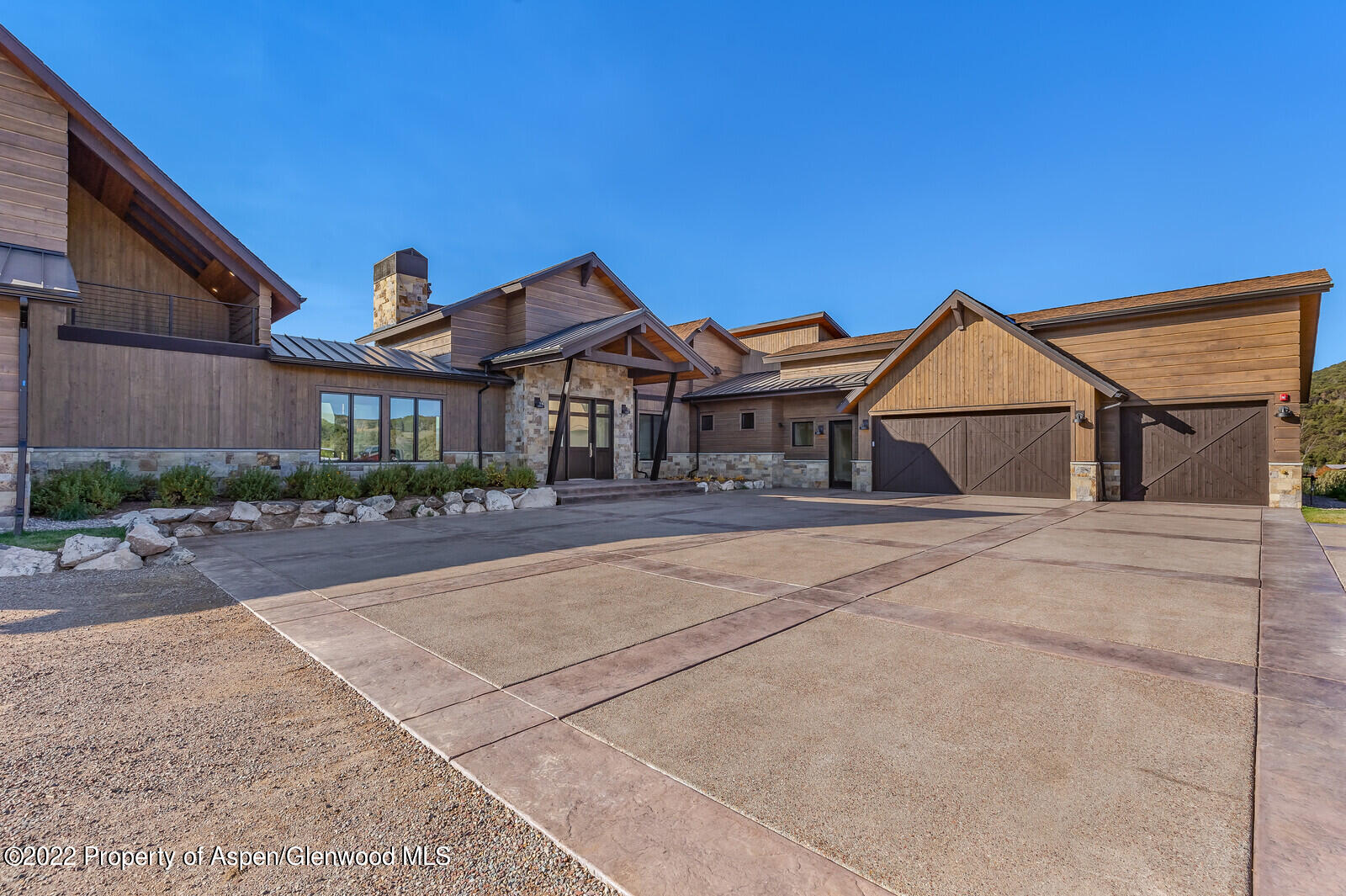 1093 Callicotte Ranch Road Carbondale, CO 81623 - Photo 27 of 27 a view of a house with a yard and potted plants