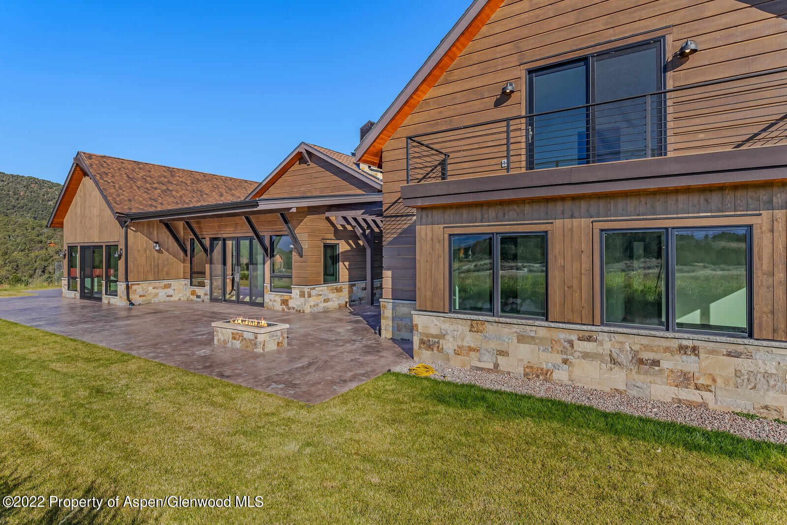 1093 Callicotte Ranch Road Carbondale, CO 81623 - Photo 3 of 27 a view of house with backyard and glass windows