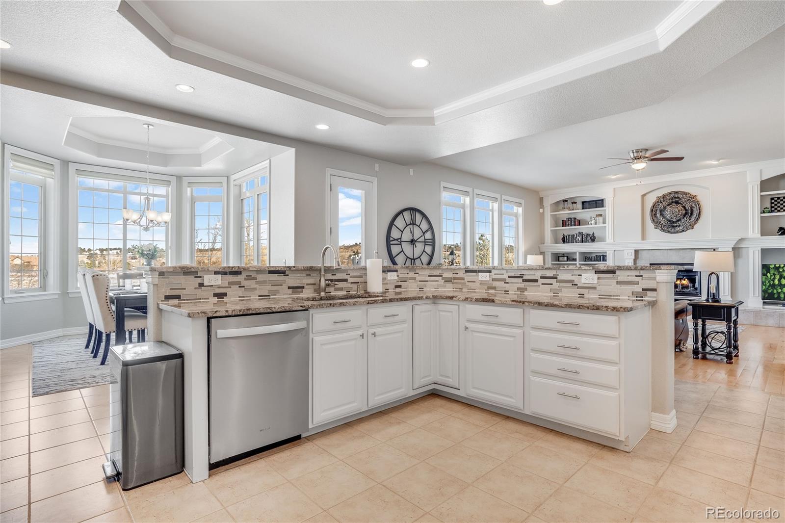 7285 Sagebrush Drive Parker, CO 80138 - Photo 15 of 46 a kitchen with granite countertop a sink and cabinets