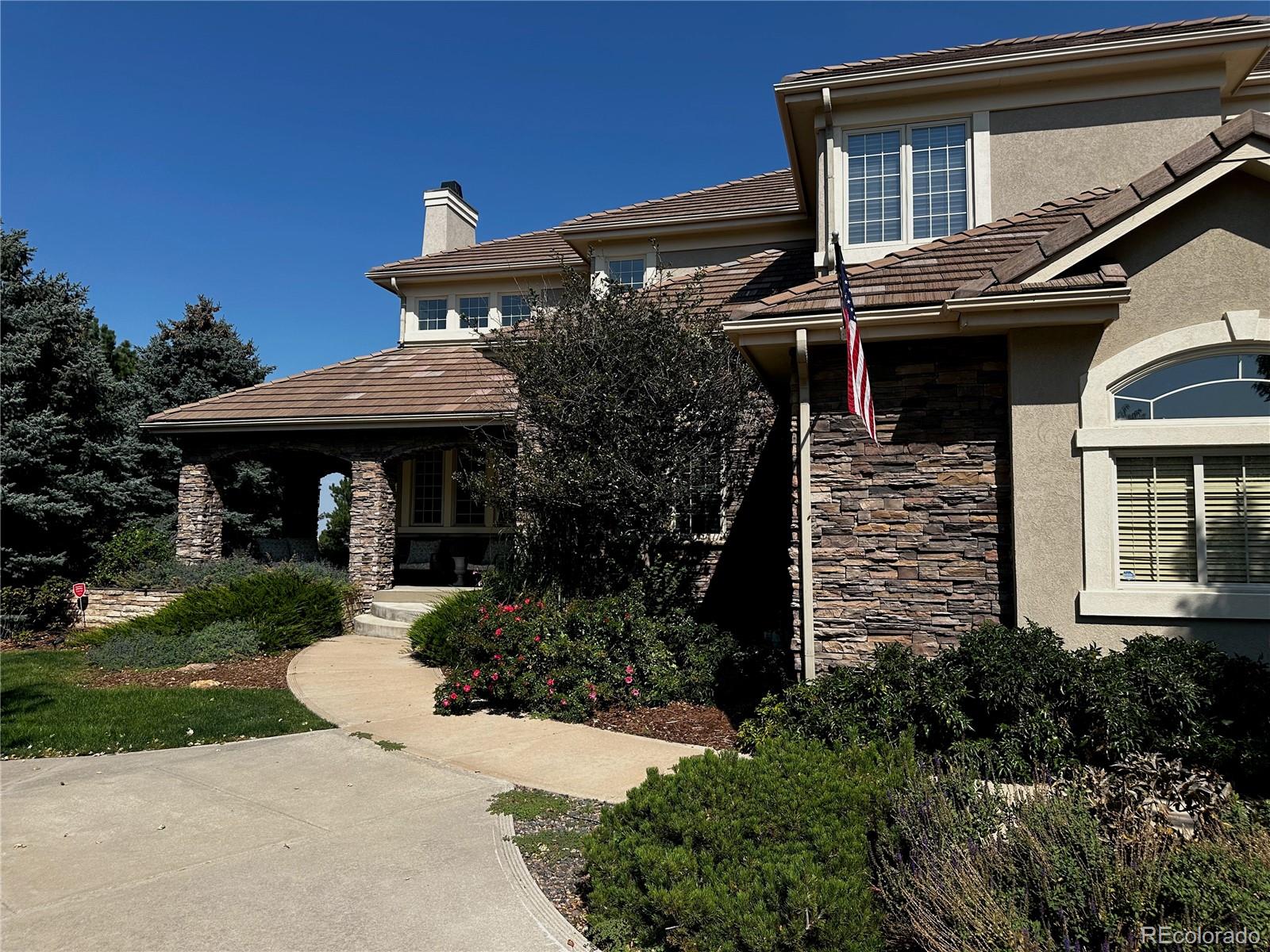 7285 Sagebrush Drive Parker, CO 80138 - Photo 2 of 46 a front view of house with a garden