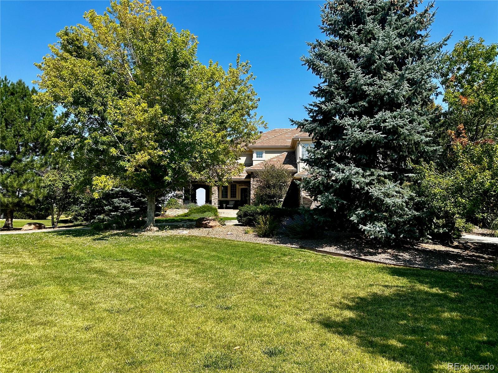 7285 Sagebrush Drive Parker, CO 80138 - Photo 3 of 46 a view of a house with swimming pool