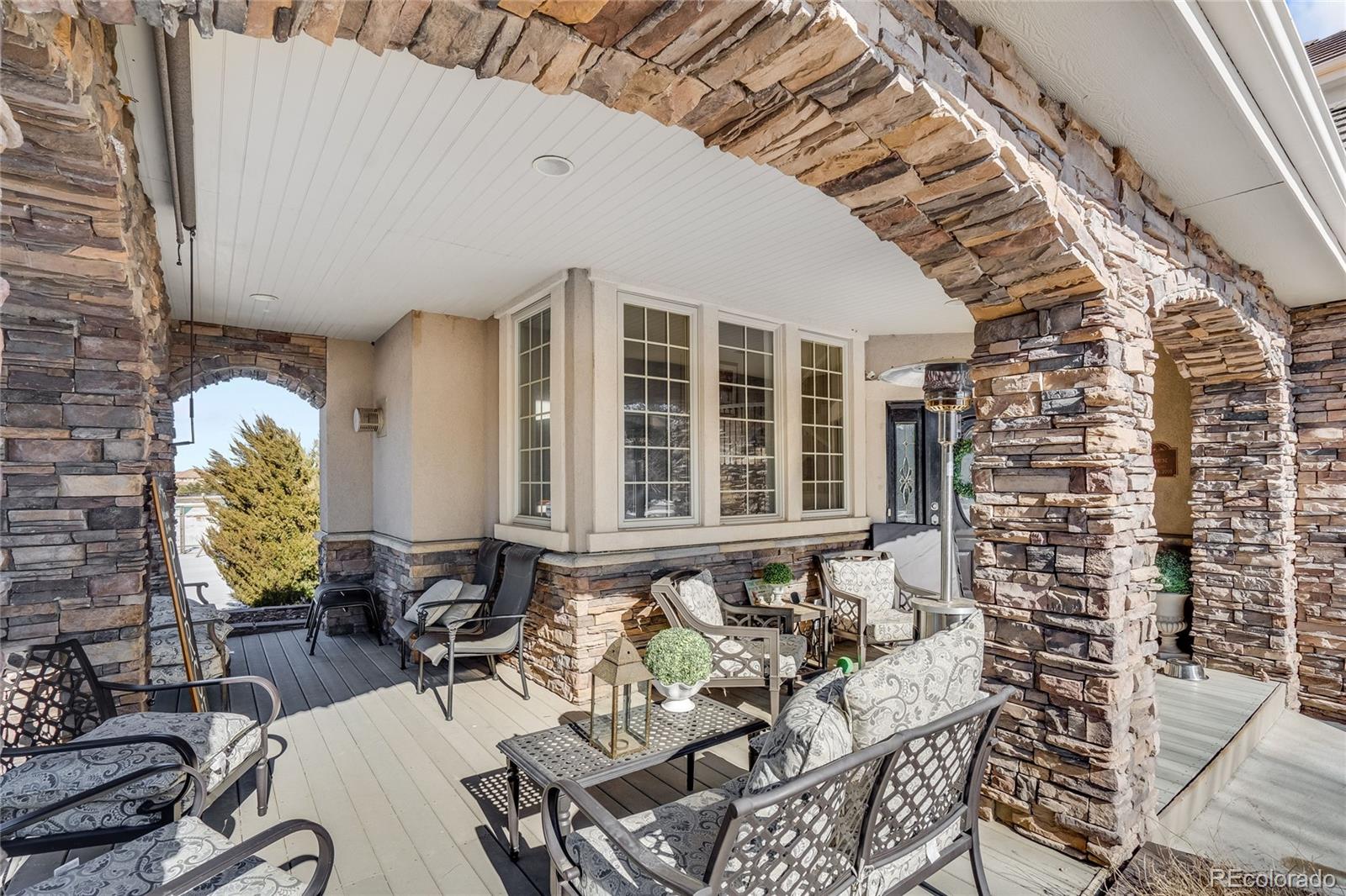 7285 Sagebrush Drive Parker, CO 80138 - Photo 5 of 46 a front view of a house with outdoor seating
