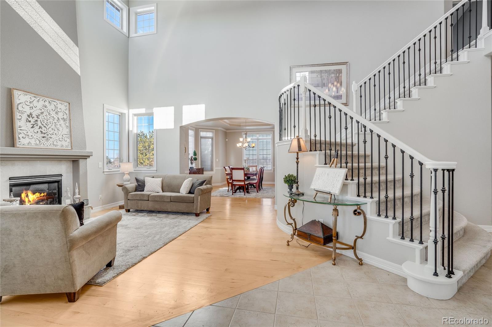 7285 Sagebrush Drive Parker, CO 80138 - Photo 7 of 46 a living room with furniture and a fireplace