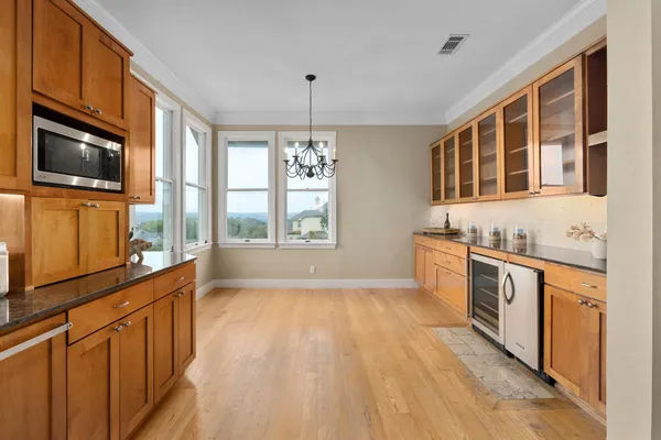 a kitchen with stainless steel appliances granite countertop a stove and a sink