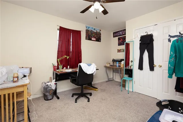 a bathroom with a toilet sink vanity and mirror
