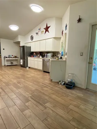 a view of a kitchen with a sink