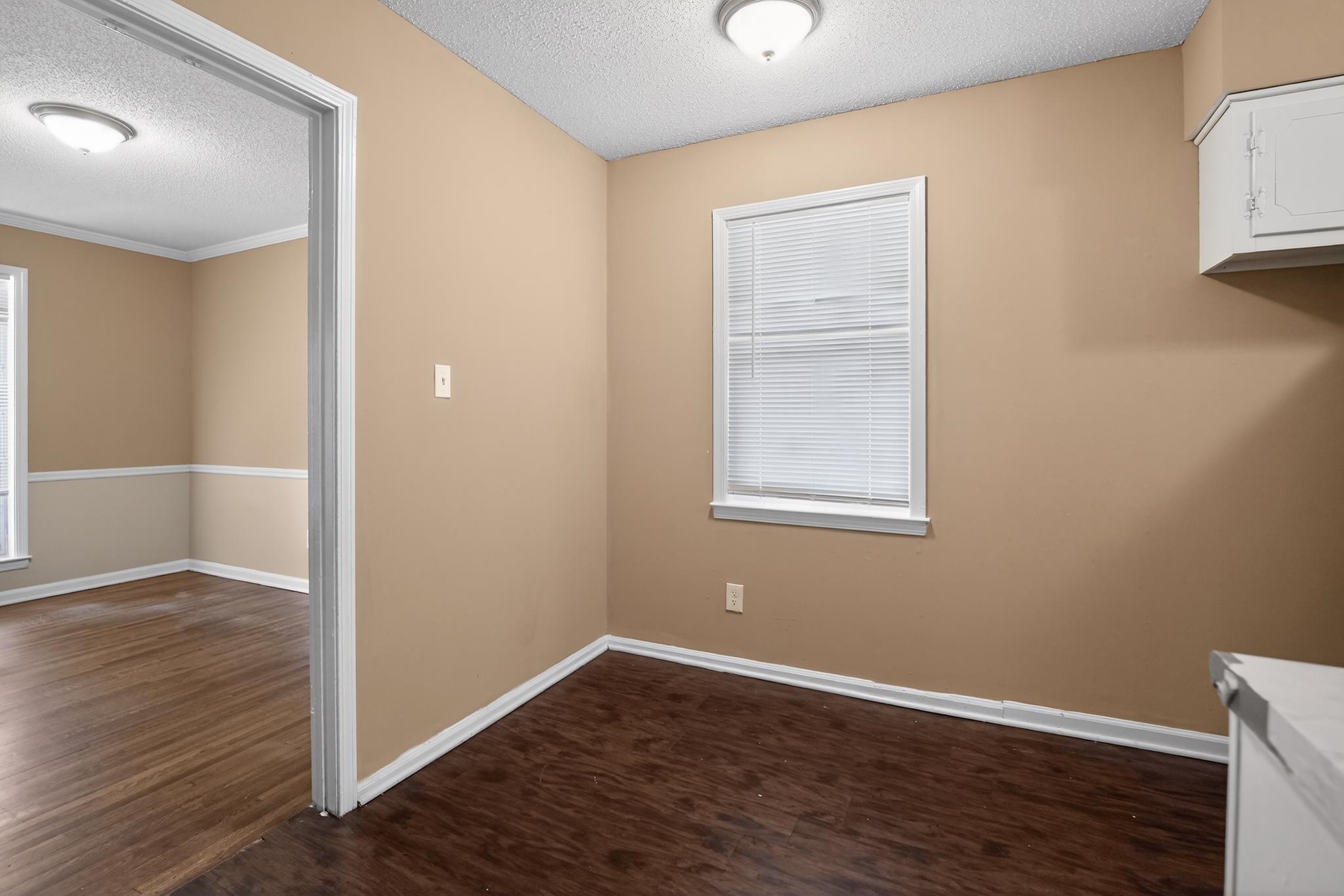 2015 East Holmes Road Memphis, TN 38116 - Photo 24 of 34 an empty room with wooden floor and windows