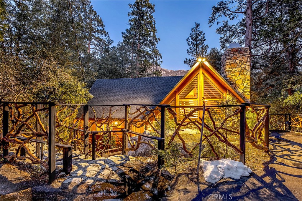 25300 Pine Crest Avenue Idyllwild, CA 92549 - Photo 1 of 75 Front of home adorned with custom Manzanita fencing.