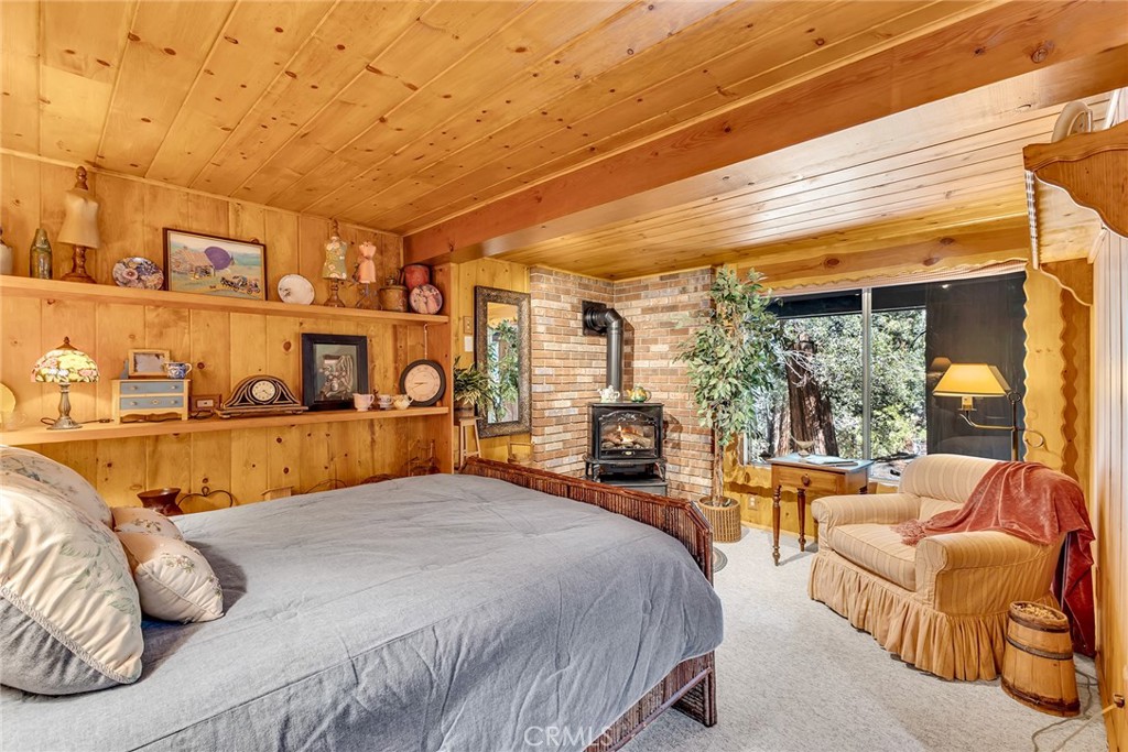 25300 Pine Crest Avenue Idyllwild, CA 92549 - Photo 50 of 75 Lower level primary bedroom suite with door leading to the exterior.