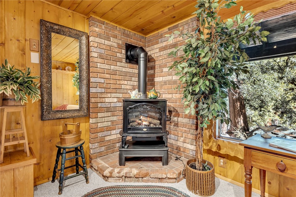 25300 Pine Crest Avenue Idyllwild, CA 92549 - Photo 52 of 75 Cozy sitting area in lower level primary bedroom suite with picture windows.