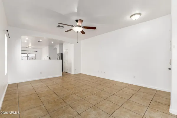 a view of an empty room and a window