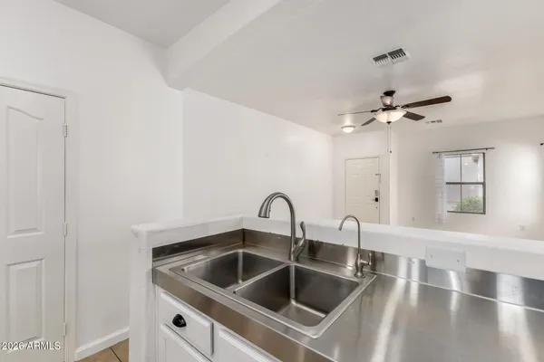 a kitchen with a sink and a window