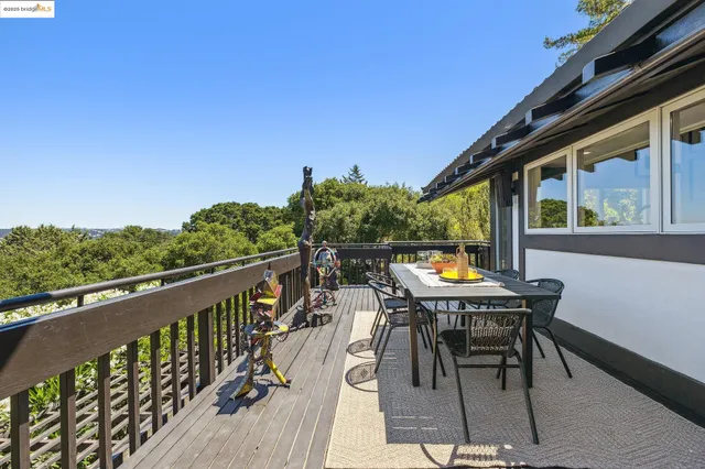 a view of a balcony with wooden floor