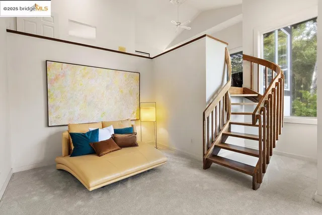 a bedroom with a large bed and a large window