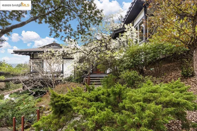 an aerial view of houses with yard