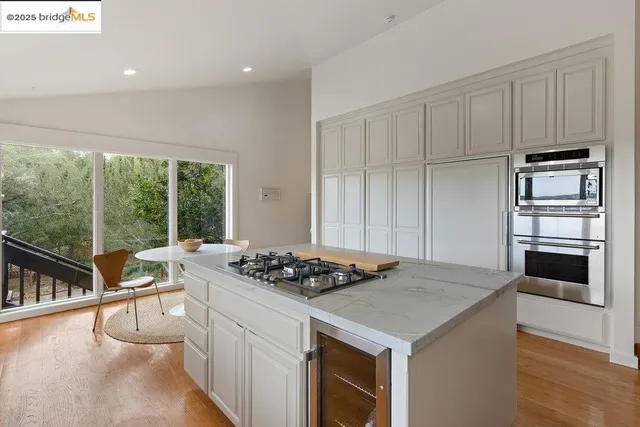 a kitchen with a stove a sink and a refrigerator
