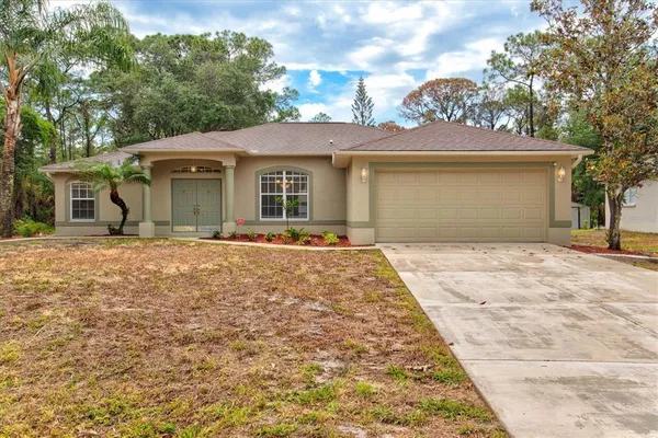 front view of a house with a yard