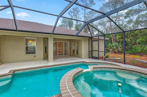 a view of a house with a yard and plants