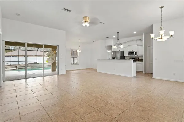 a view of a kitchen with a stove and cabinets
