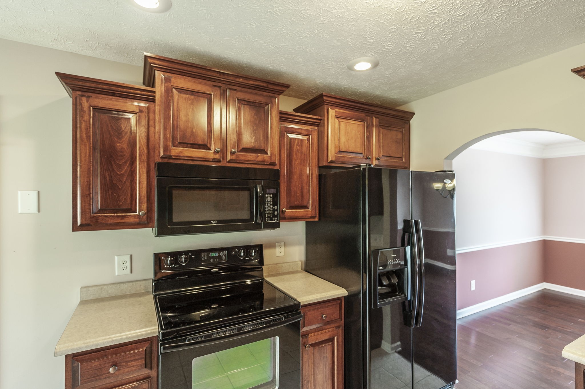 7535 Swift Road Greenbrier, TN 37073 - Photo 12 of 51 a kitchen with granite countertop a refrigerator stove and microwave
