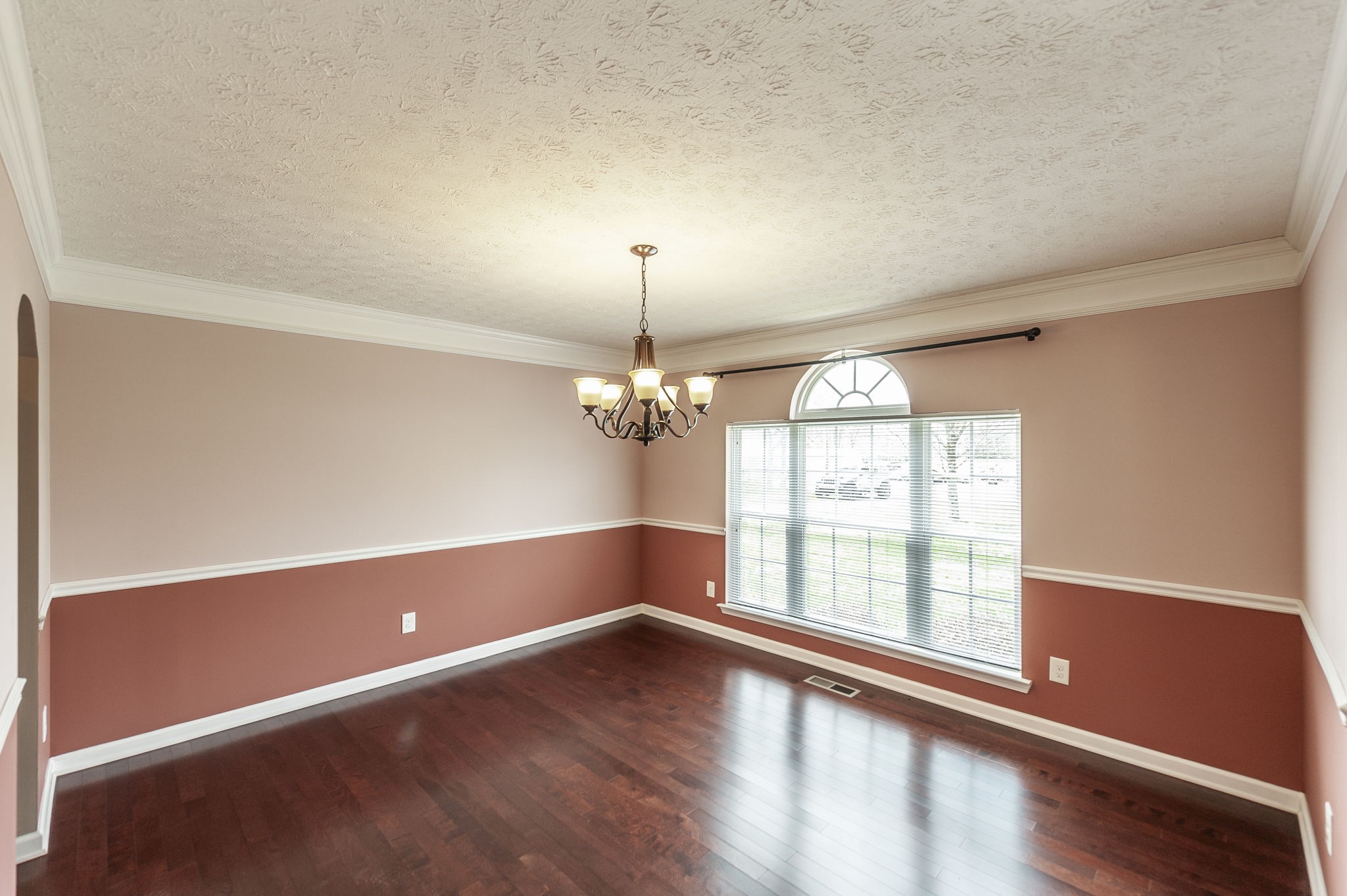 7535 Swift Road Greenbrier, TN 37073 - Photo 15 of 51 an empty room with wooden floor and windows