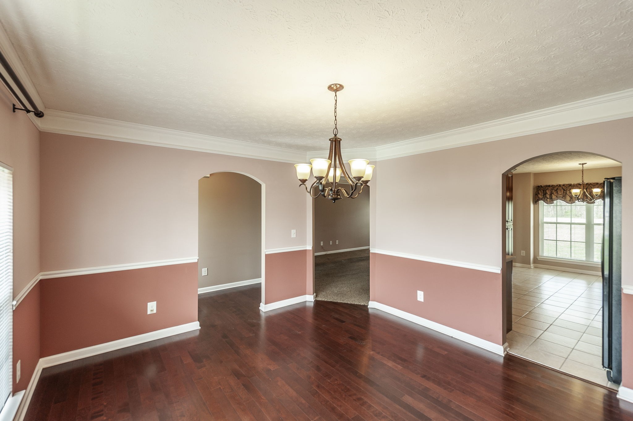 7535 Swift Road Greenbrier, TN 37073 - Photo 17 of 51 a view of a livingroom with wooden floor and chandelier