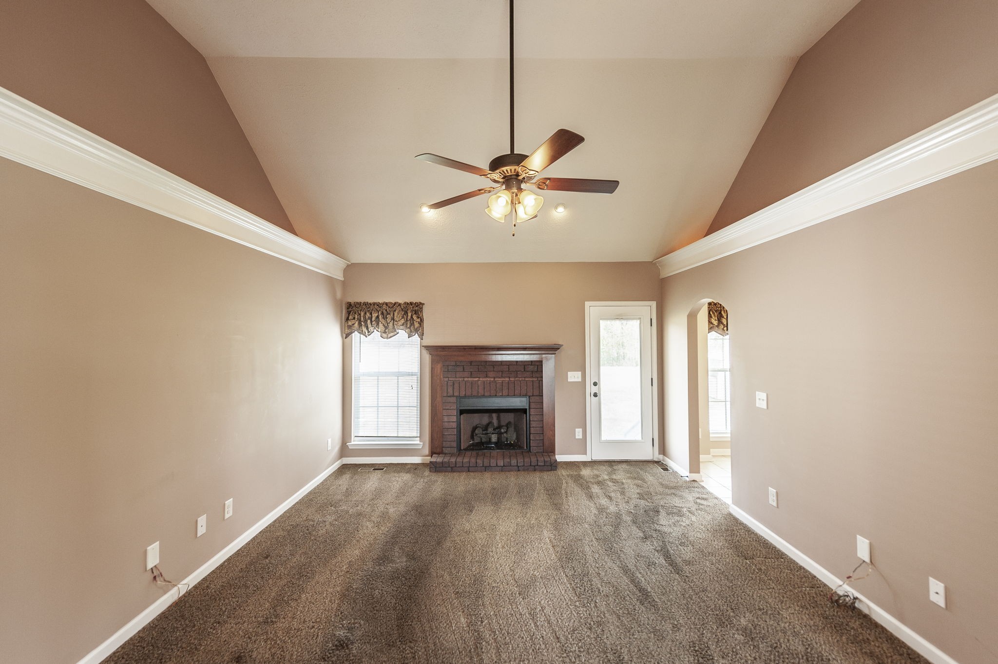 7535 Swift Road Greenbrier, TN 37073 - Photo 19 of 51 a view of an empty room with a fireplace and a window