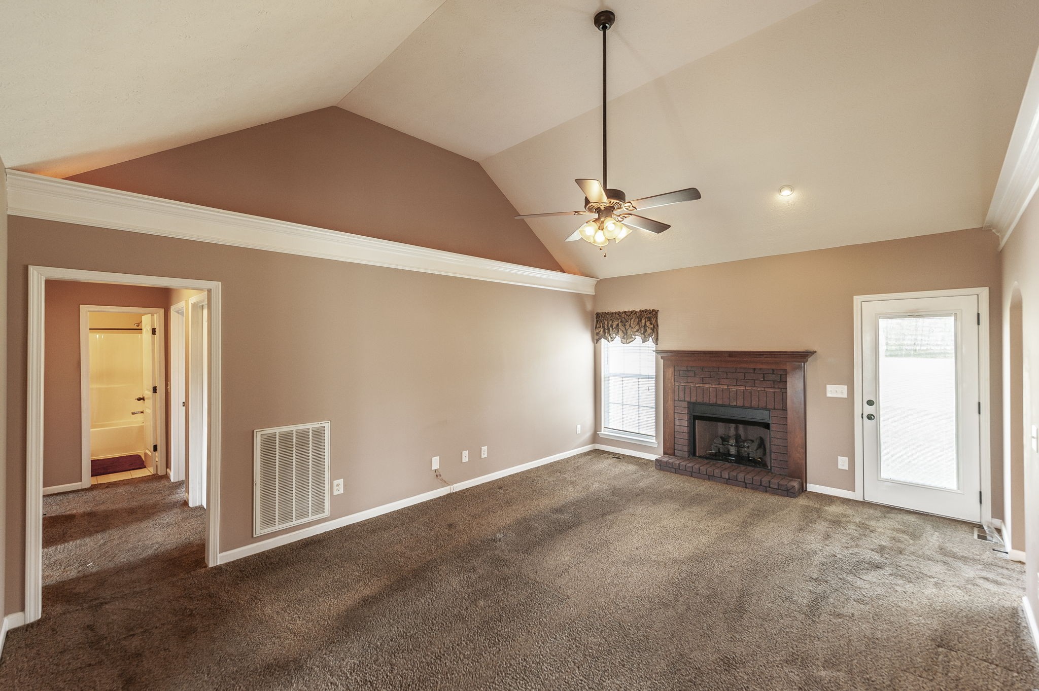 7535 Swift Road Greenbrier, TN 37073 - Photo 23 of 51 a view of empty room with a fireplace and fan