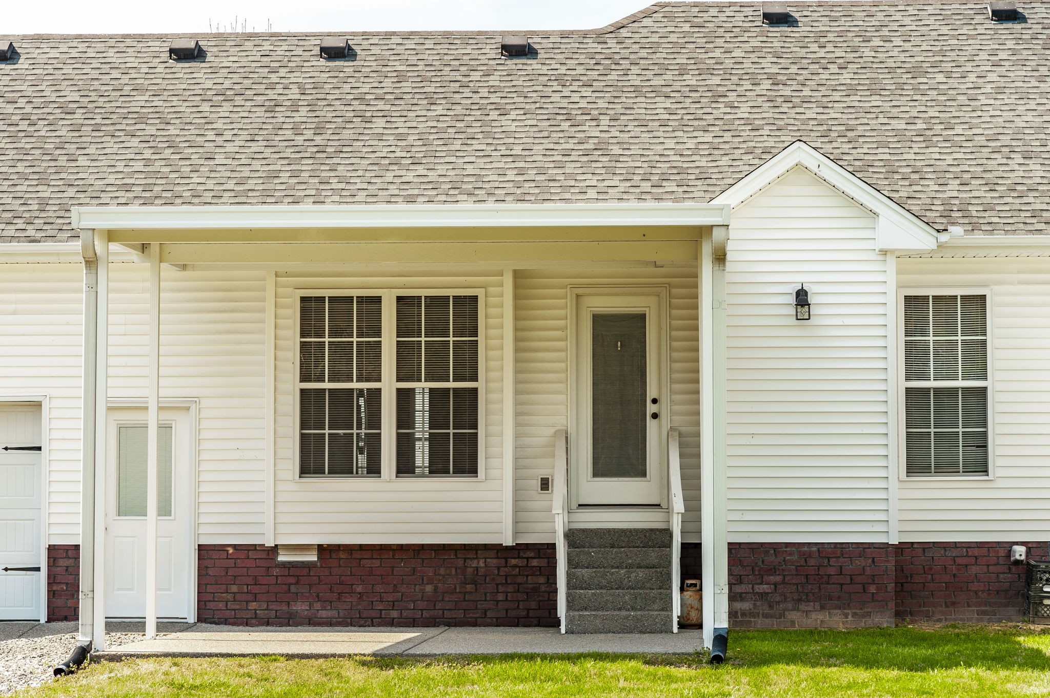 7535 Swift Road Greenbrier, TN 37073 - Photo 43 of 51 a front view of a house with a yard and garage