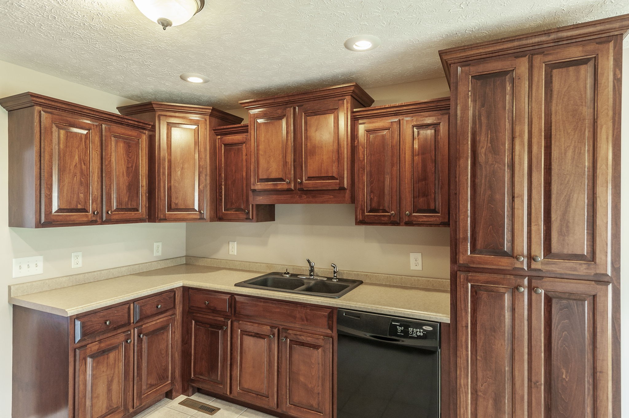 7535 Swift Road Greenbrier, TN 37073 - Photo 9 of 51 a kitchen with wooden cabinets and a sink