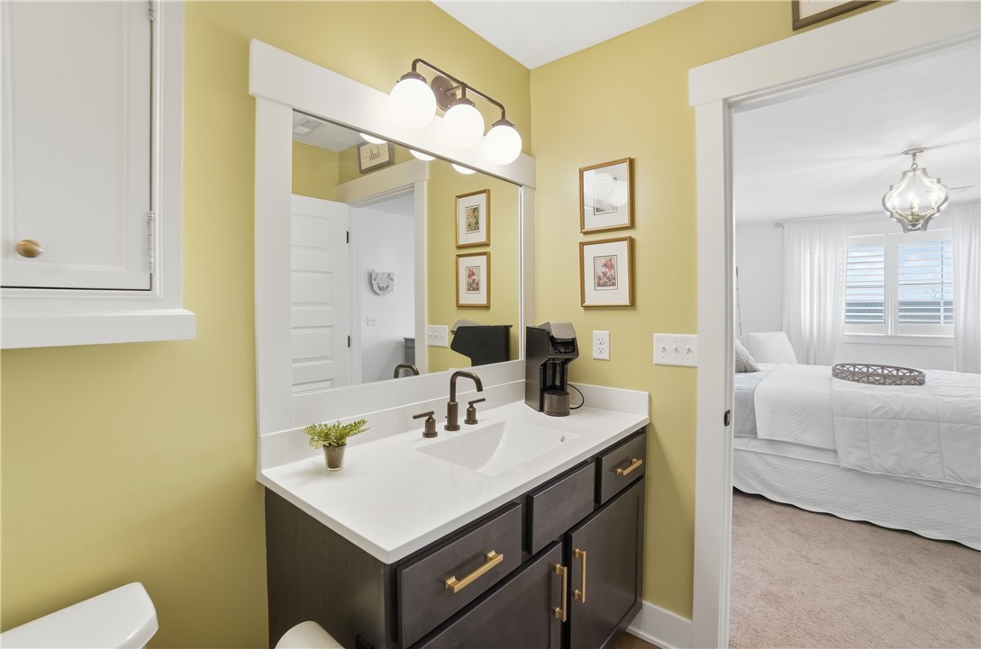 605 Cape Cod Court Beavercreek, OH 45430 - Photo 40 of 54 This bathroom features a contemporary vanity with a sleek countertop and a spacious mirror.