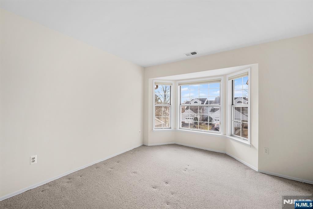 11A Rothwell Drive, Unit 11D Monroe Township, NJ 08831 - Photo 24 of 47 an empty room with windows
