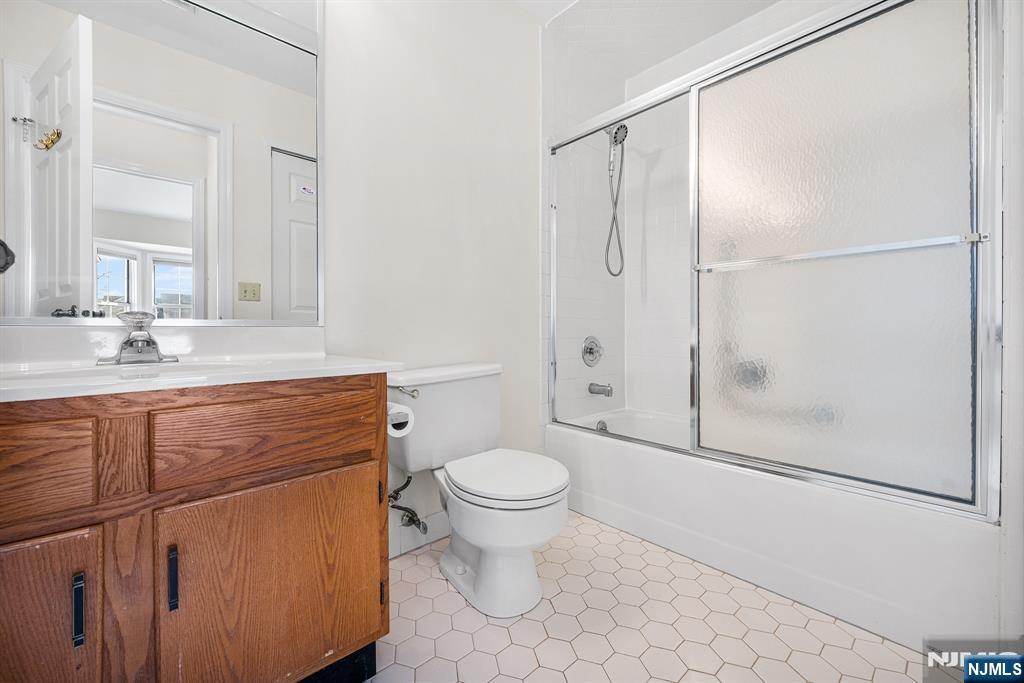 11A Rothwell Drive, Unit 11D Monroe Township, NJ 08831 - Photo 28 of 47 a bathroom with a granite countertop sink toilet and shower