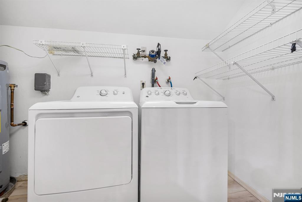 11A Rothwell Drive, Unit 11D Monroe Township, NJ 08831 - Photo 30 of 47 a utility room with dryer and washer