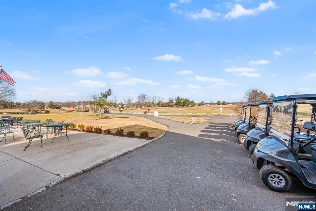11A Rothwell Drive, Unit 11D Monroe Township, NJ 08831 - Photo 42 of 47 an ocean beach with couple of cars parked