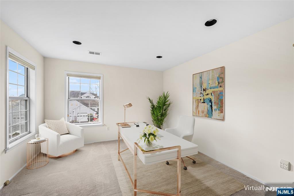 11A Rothwell Drive, Unit 11D Monroe Township, NJ 08831 - Photo 45 of 47 a living room with furniture and a potted plant