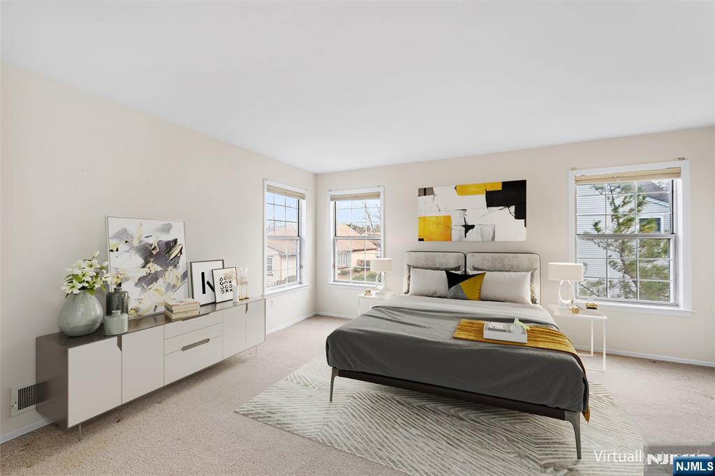 11A Rothwell Drive, Unit 11D Monroe Township, NJ 08831 - Photo 46 of 47 a bedroom with a large bed and a couch