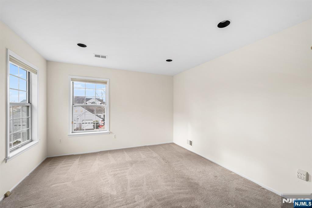 11A Rothwell Drive, Unit 11D Monroe Township, NJ 08831 - Photo 9 of 47 an empty room with windows